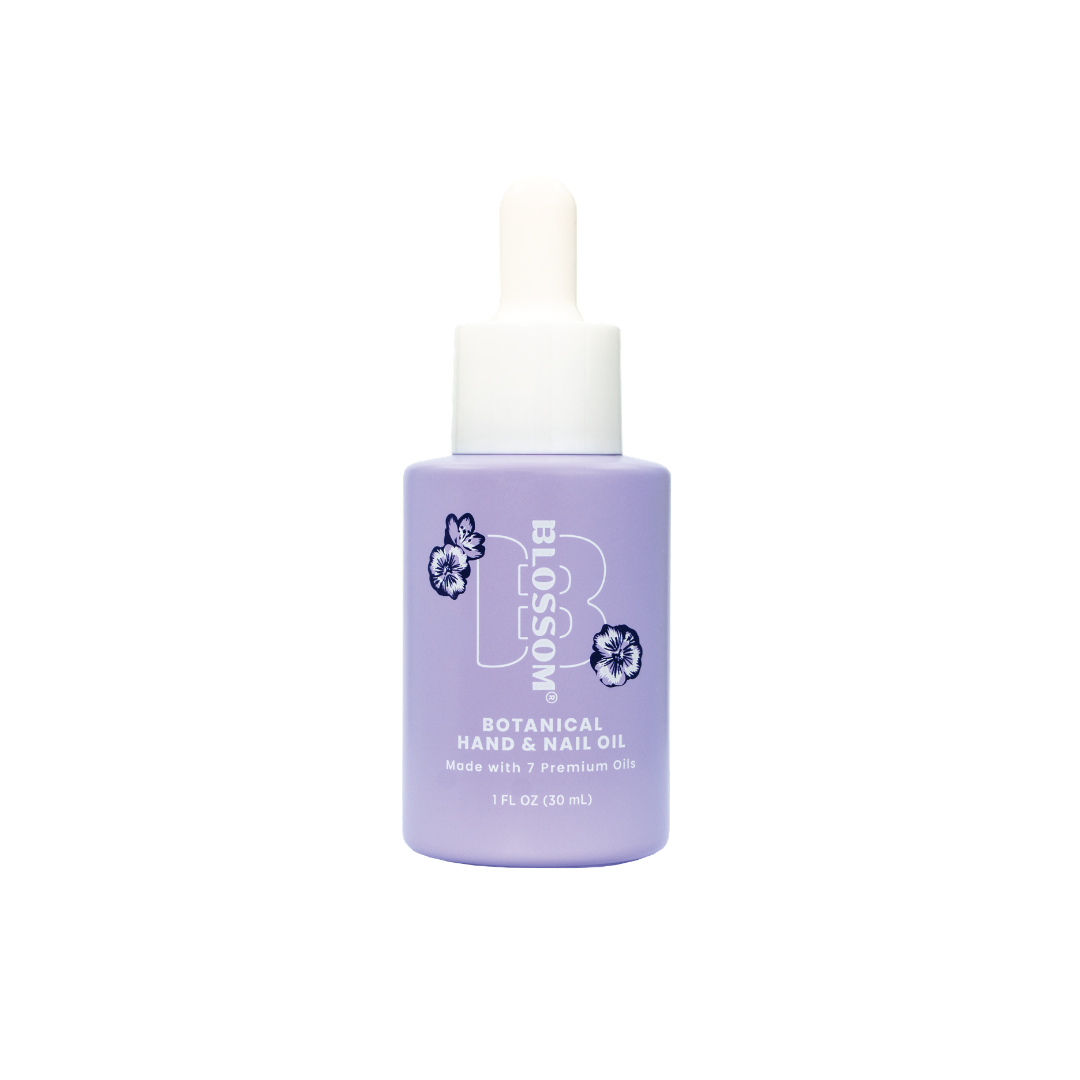 Lavender bottle of Blossom Botanical Hand and Nail Oil with dropper